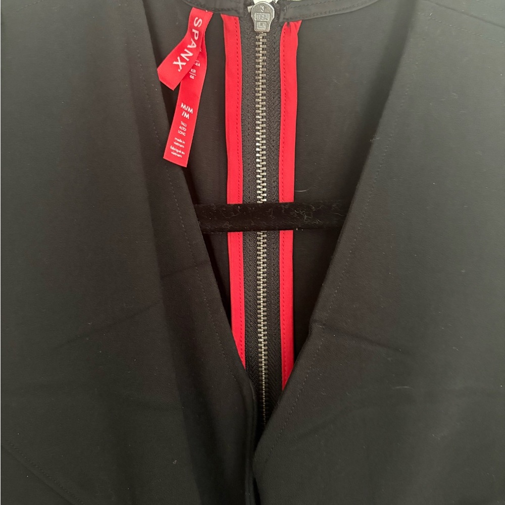 SPANX Black Garment with Red Zipper Detail